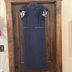 Elegant Navy Dress with Patterned Sleeves